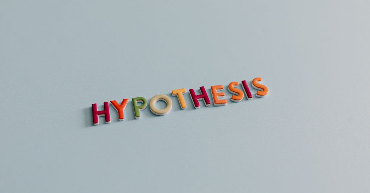 Multicolored letters spell 'HYPOTHESIS' on a light blue surface, conveying research and creativity.